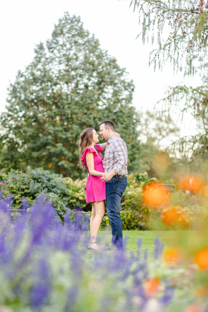 flower garden engagement photo in sioux falls